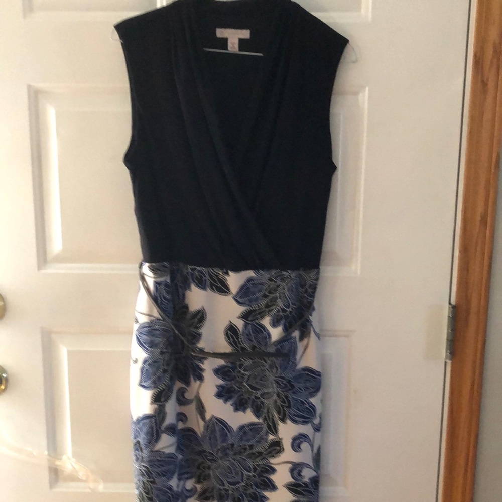 Black top with royal blue/black print bottom with contrasting silver belt